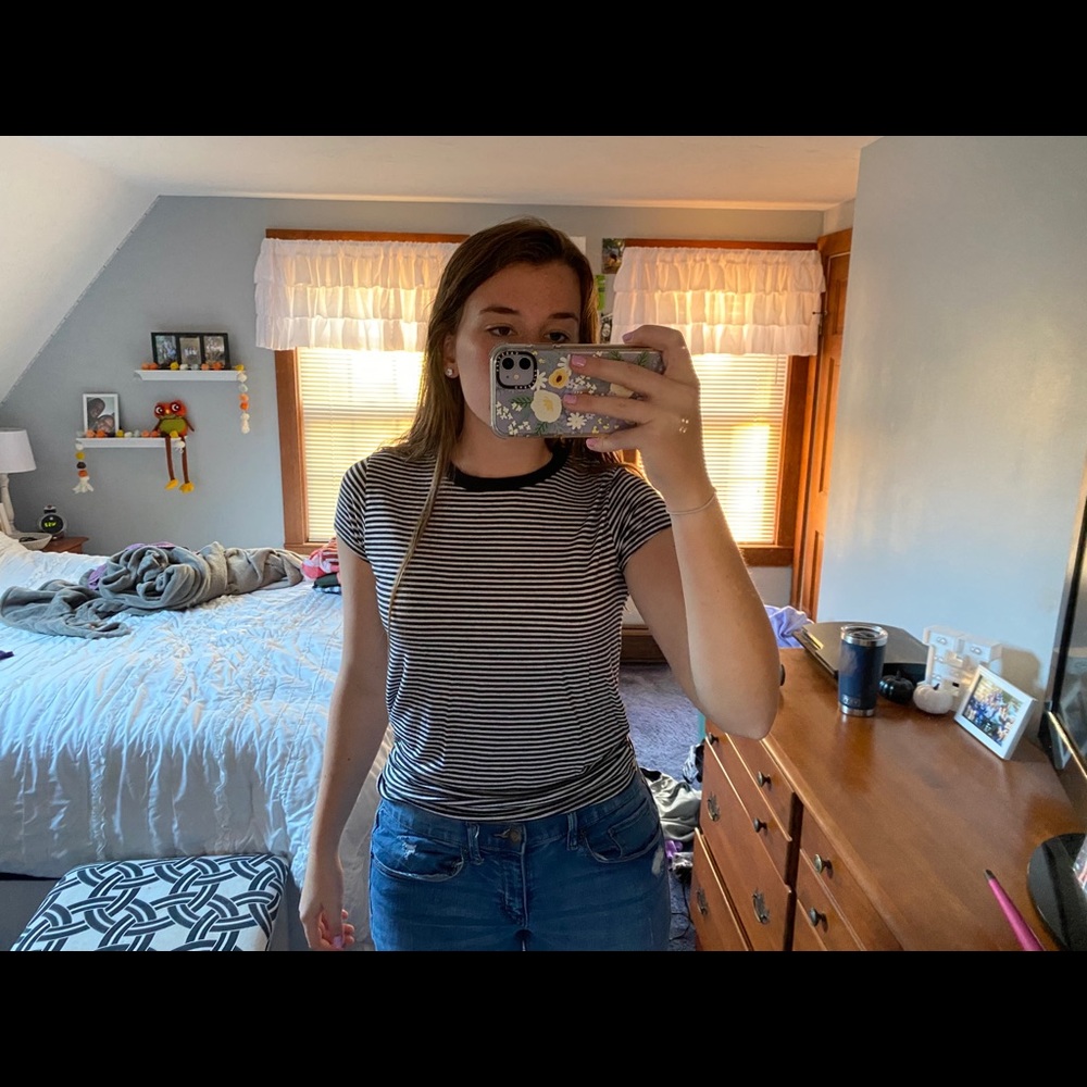 Black and white striped t-shirt.